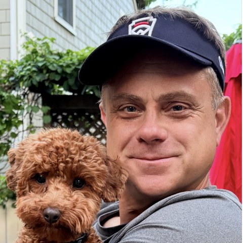 Damian holding his dog